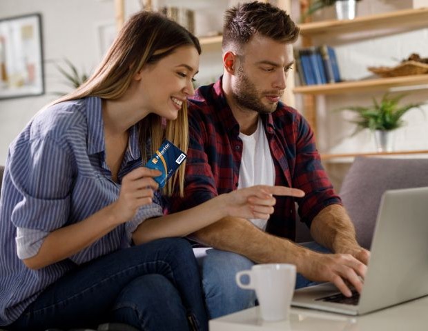 Couple with Visa CC and laptop Visa CC