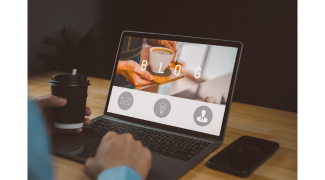 woman with a coffee and at her lap top