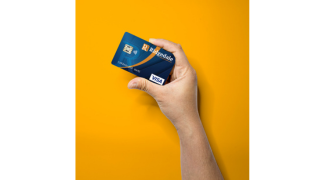 woman with a coffee and at her lap top